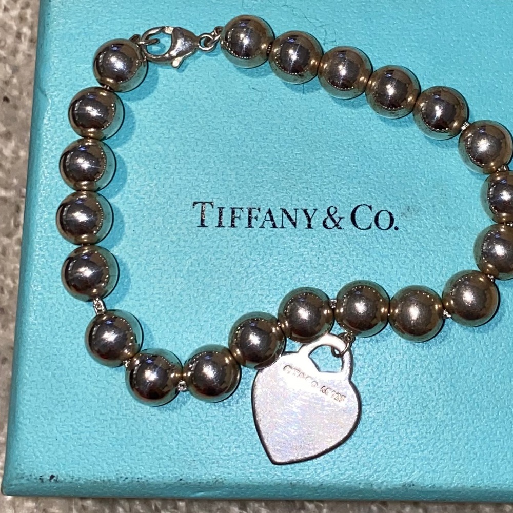Tiffany sterling silver bracelet with charm